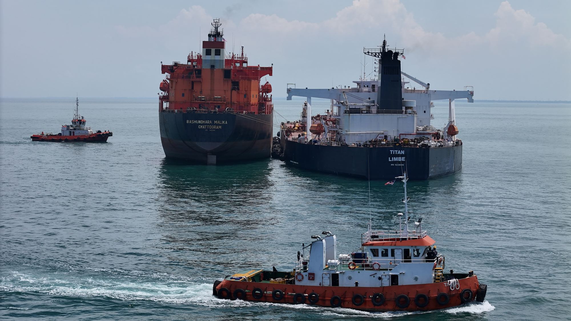 Tug escorting tankers at sea