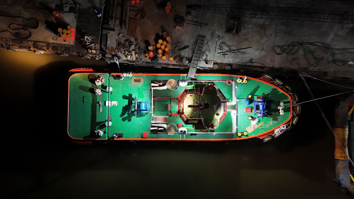 Vessel deck lit up at night, seen from above