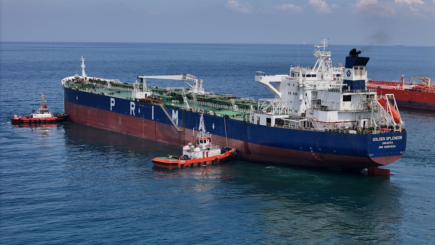 Tugs attending a tanker at sea