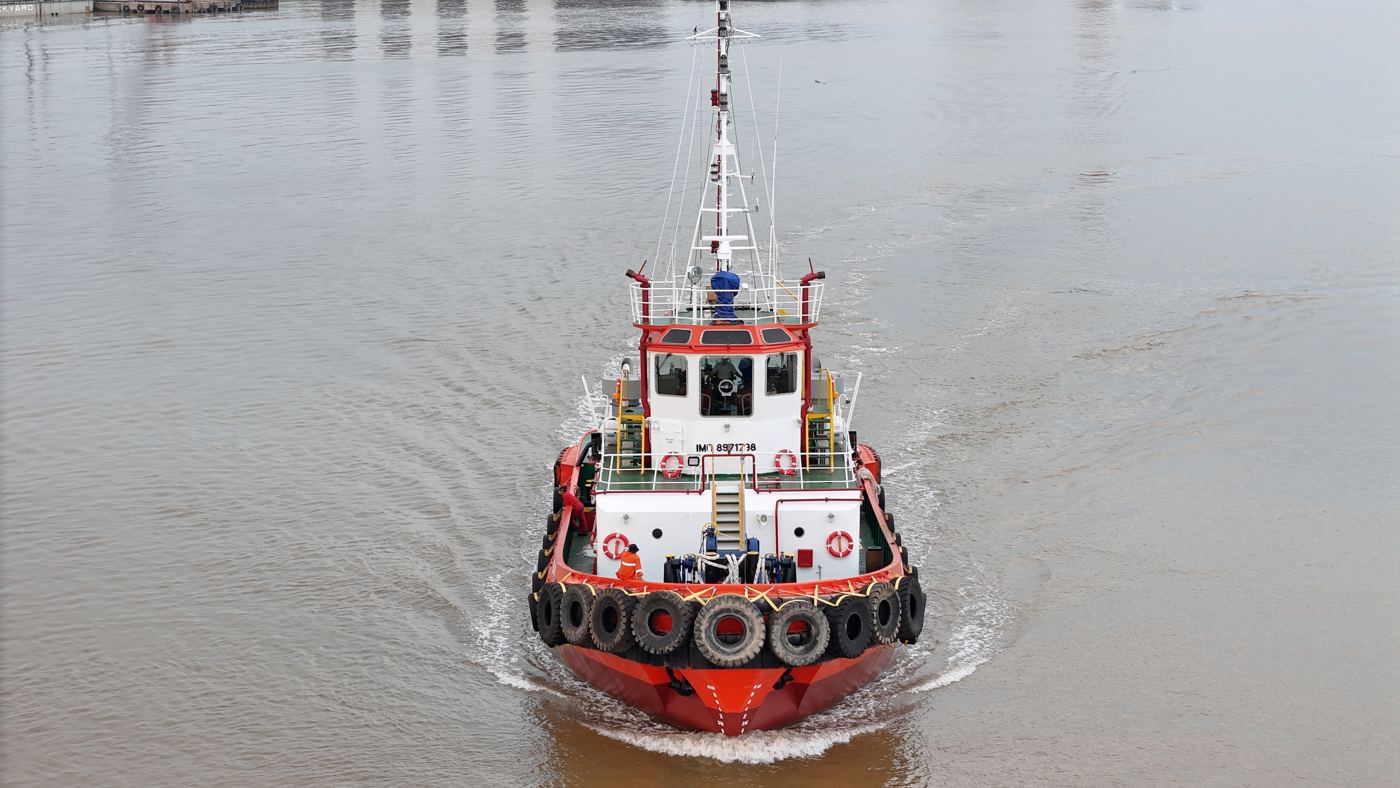 Harbour tug under way